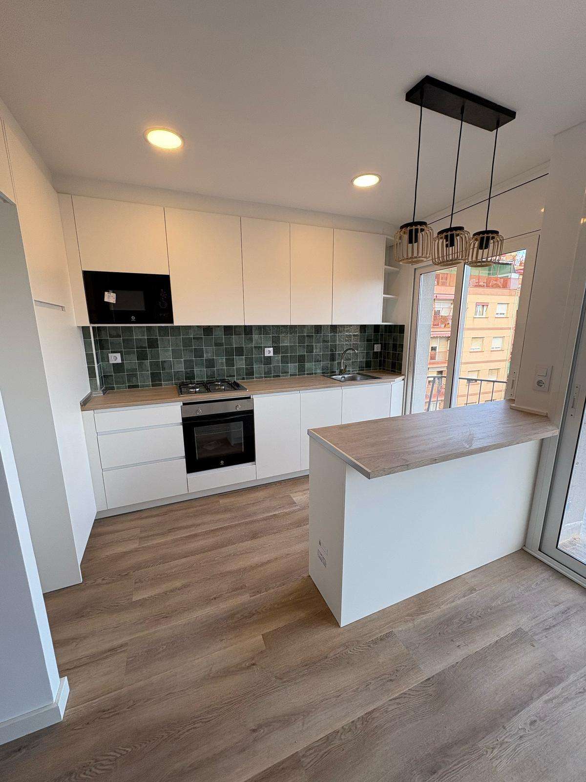 Renovated kitchen in Barcelona with modern design